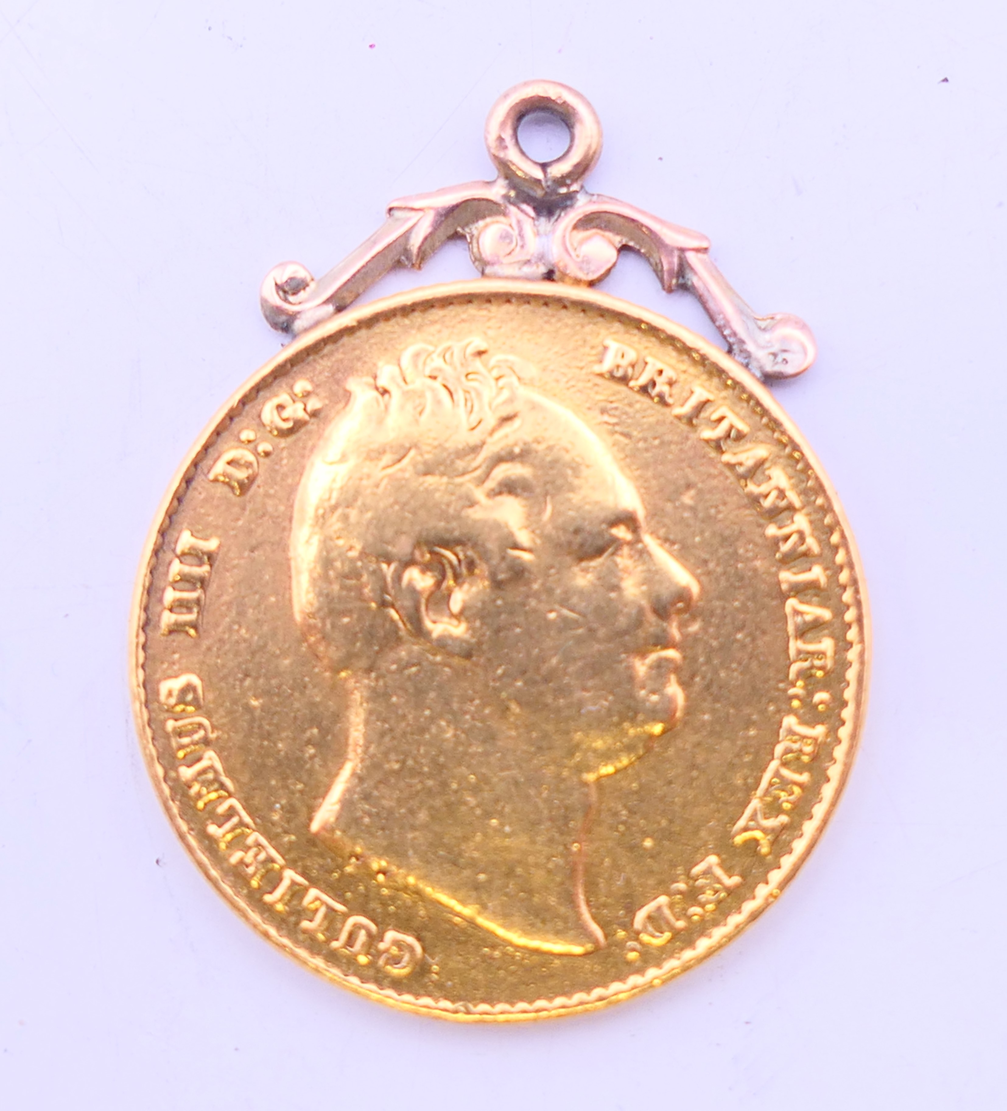 An 1835 gold sovereign with pendant mount. 8.2 grammes.