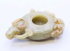 A jade ink pot in the form of a ram. 9 cm x 5.75 cm.