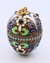 An egg pendant, bearing Russian marks. 4 cm high.