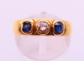 A 22 ct gold diamond and sapphire ring, hallmarked for London 1884. Ring size N/O.