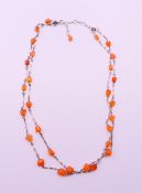 A silver and agate double strand necklace. 40 cm long.