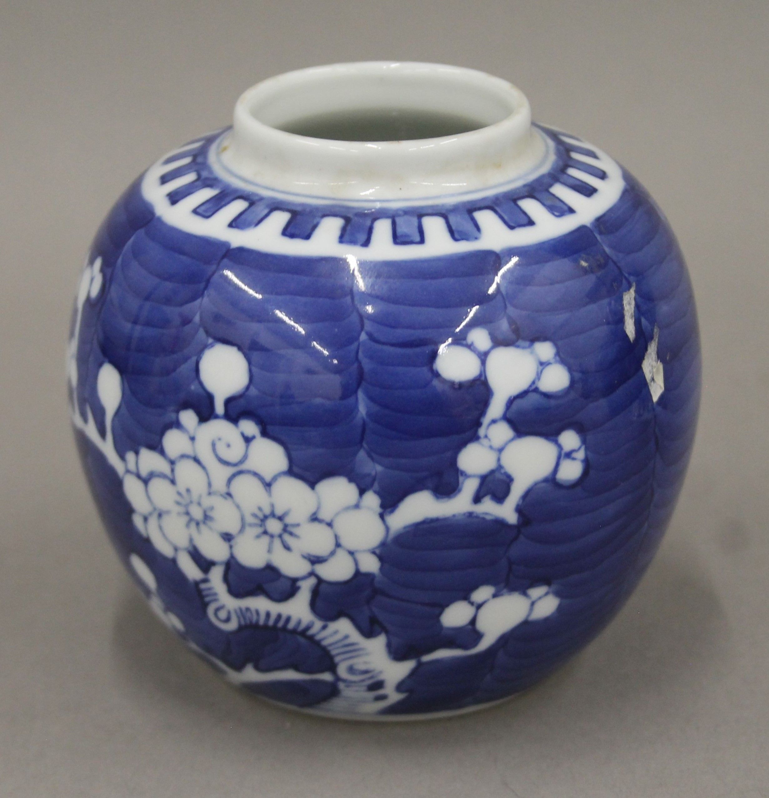 A 19th century Chinese porcelain blue and white prunus vase, two ginger jars and a sleeve vase. - Image 5 of 13