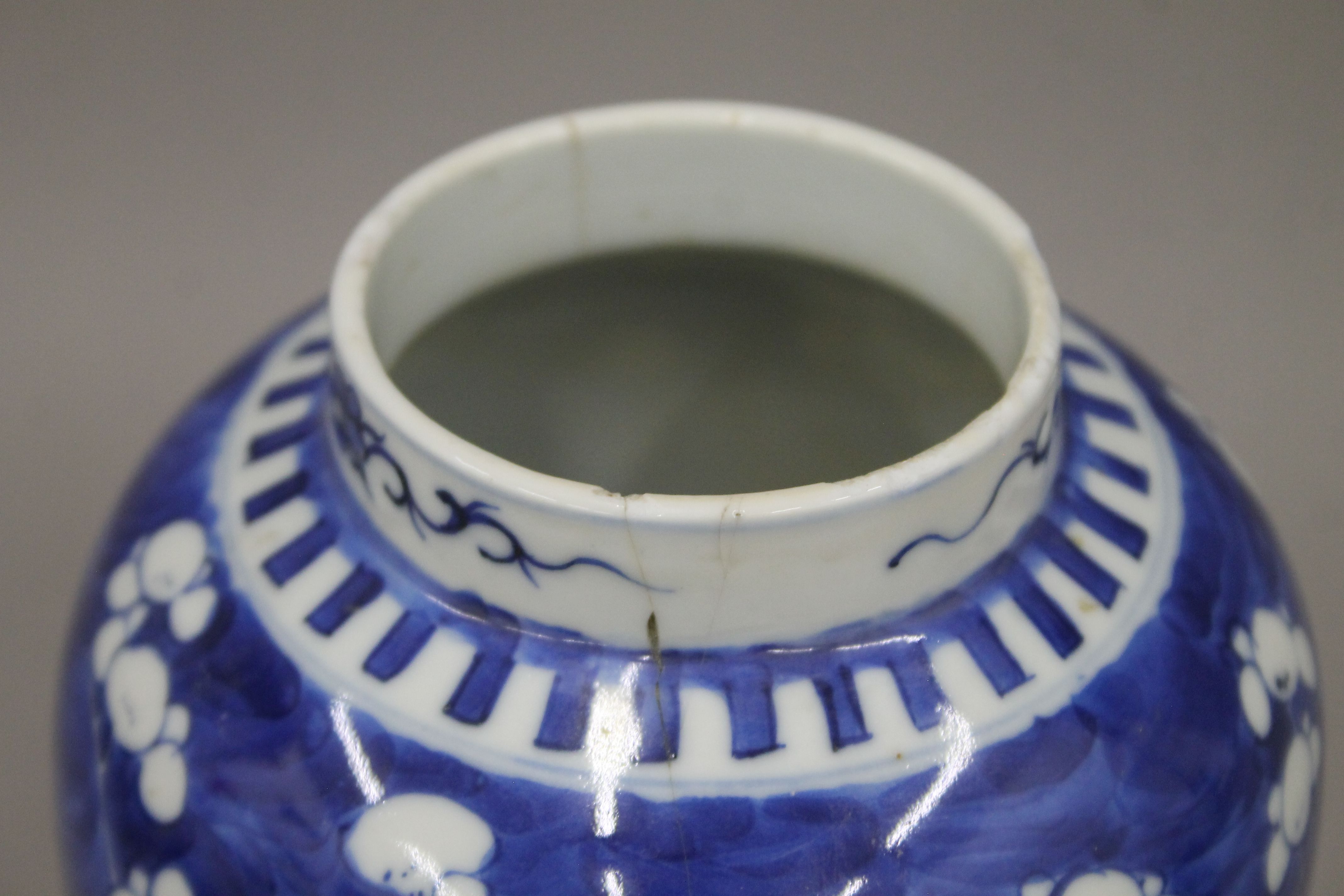 A 19th century Chinese porcelain blue and white prunus vase, two ginger jars and a sleeve vase. - Image 9 of 13