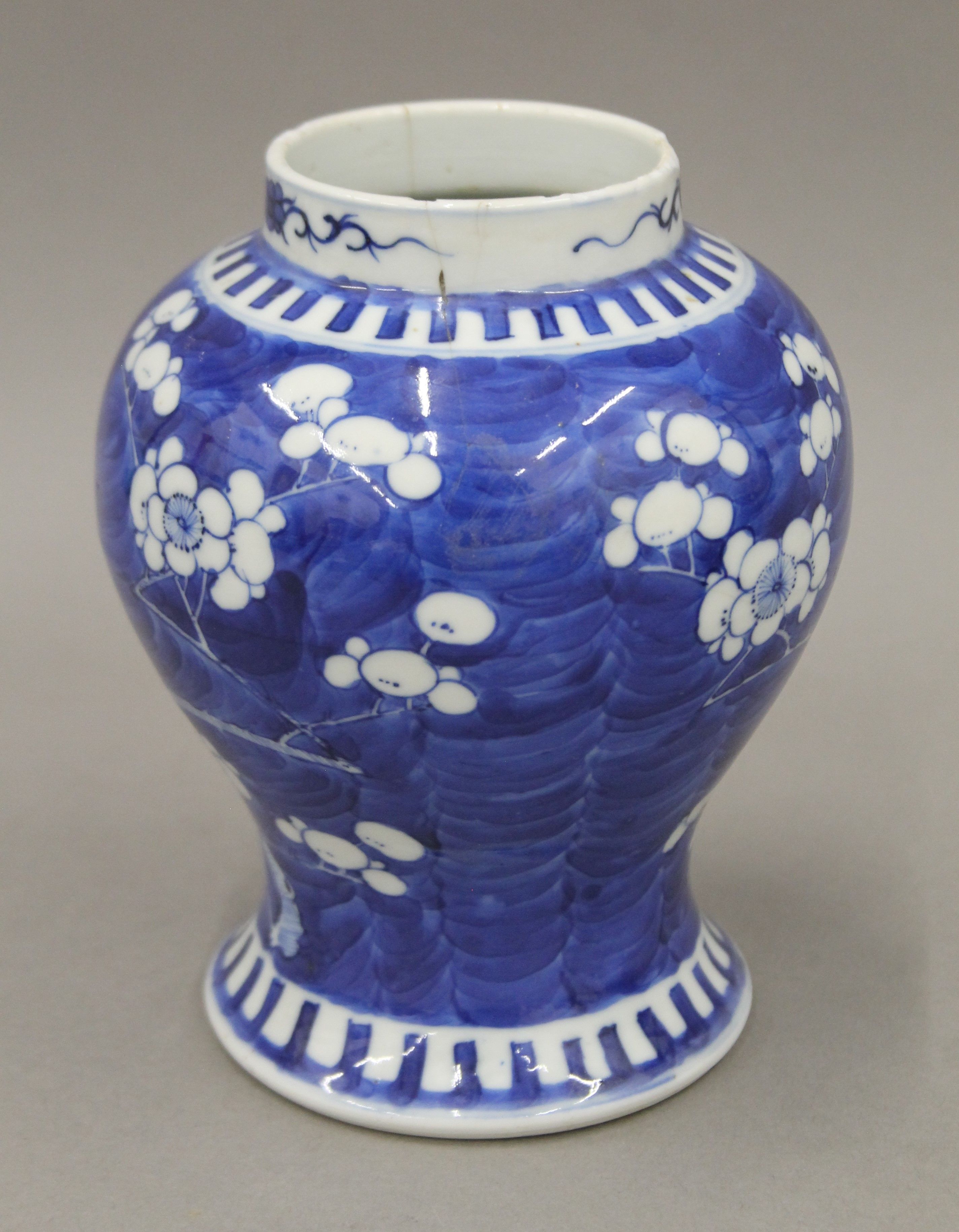 A 19th century Chinese porcelain blue and white prunus vase, two ginger jars and a sleeve vase. - Image 8 of 13