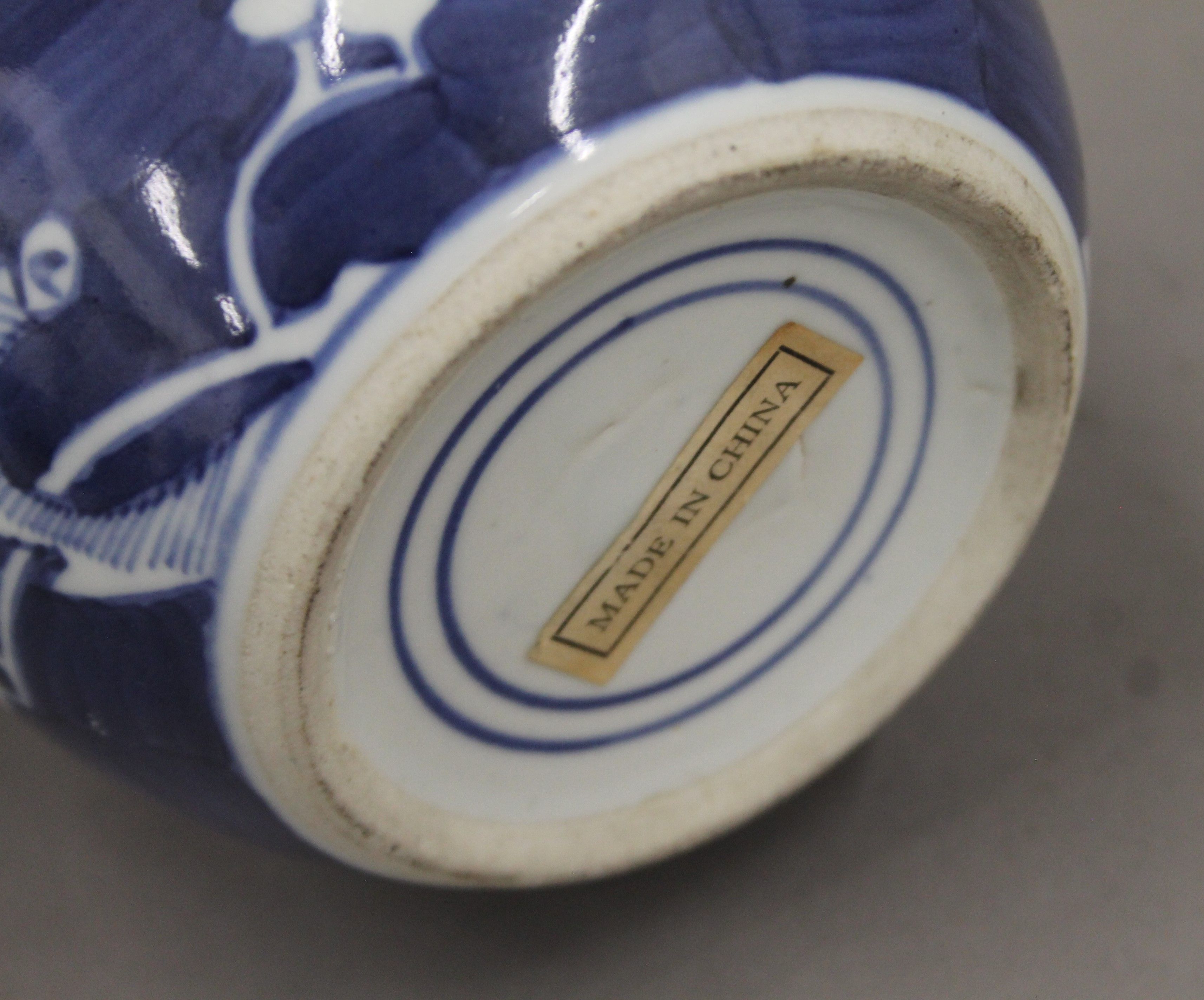 A 19th century Chinese porcelain blue and white prunus vase, two ginger jars and a sleeve vase. - Image 13 of 13