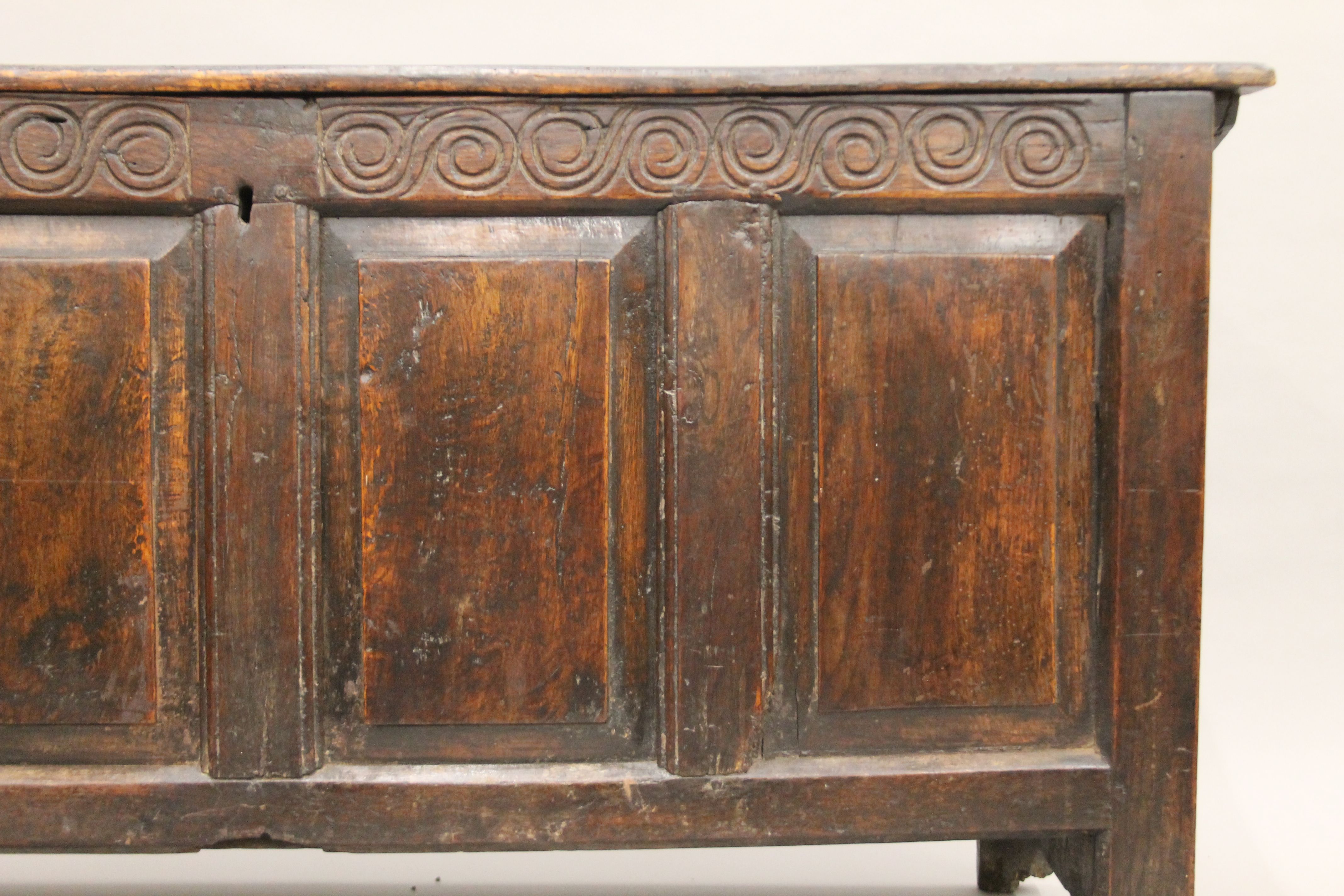 An 18th century carved oak four-panel coffer. 137 cm long. - Image 4 of 10