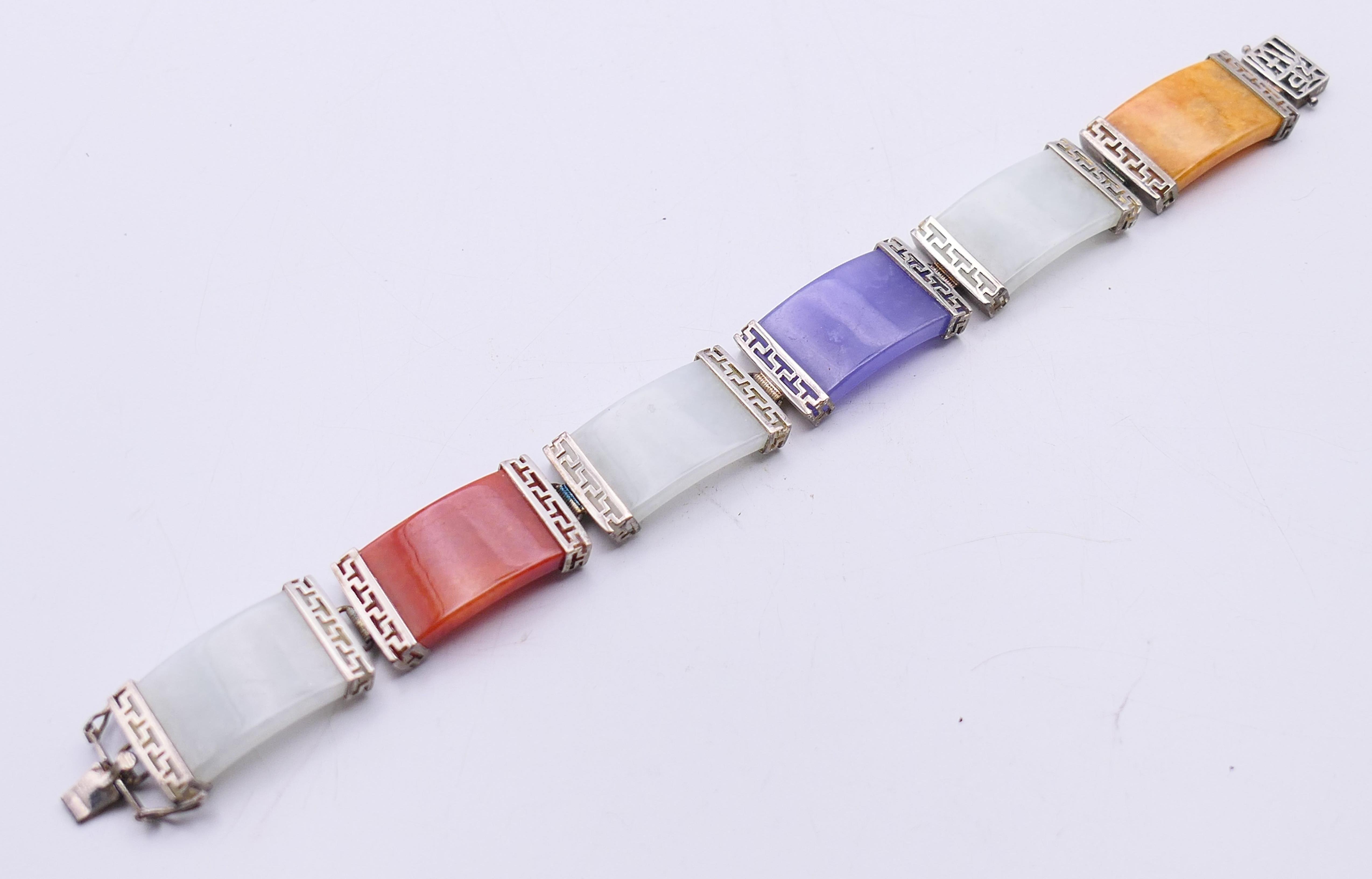 A Chinese multi-coloured jade bracelet set in silver. 18 cm long. - Image 5 of 6