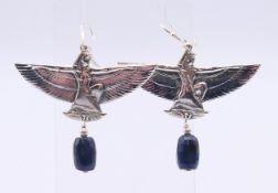 A pair of silver and lapis lazuli Art Deco-style Egyptian revival earrings. 5.5 cm wide.