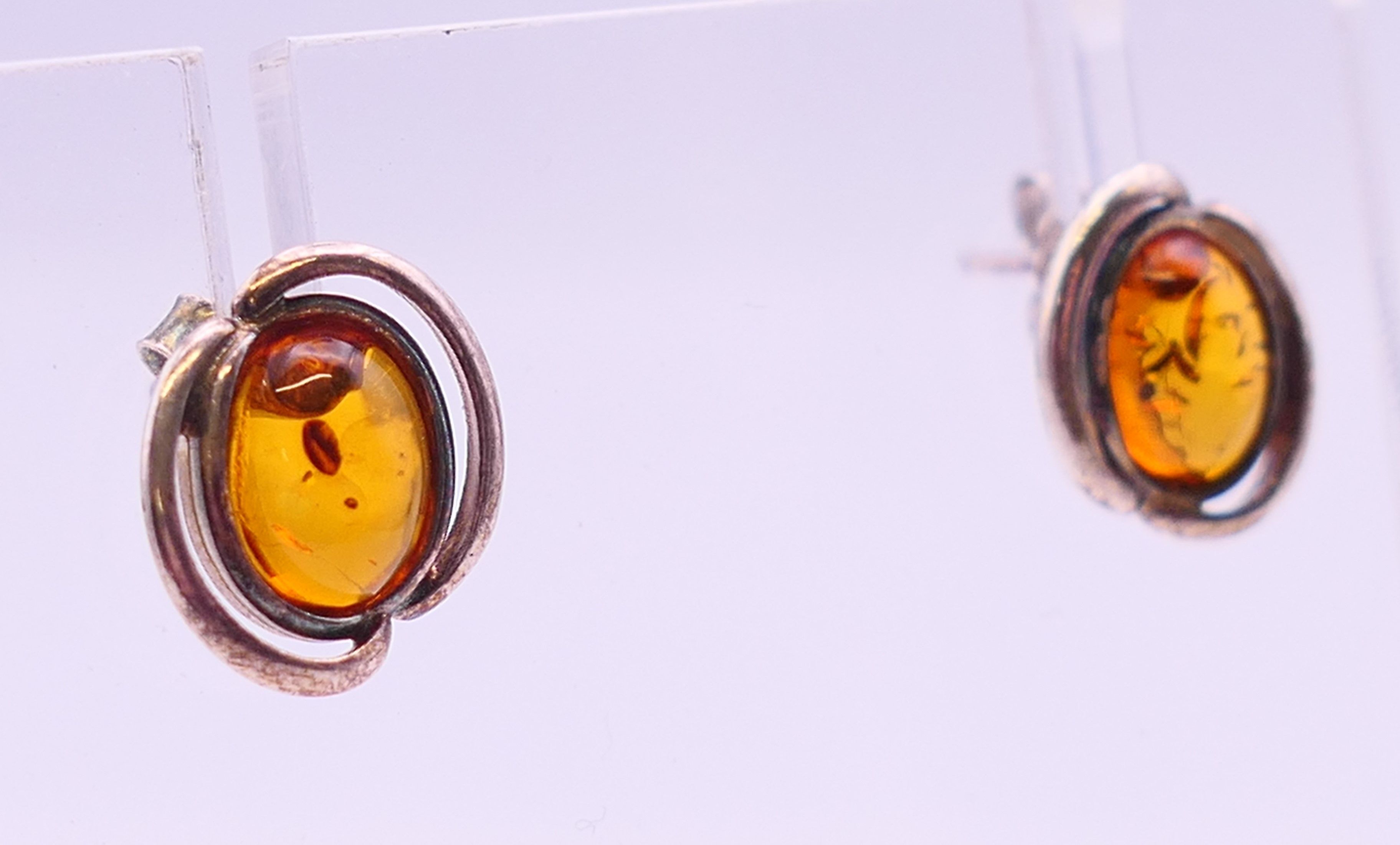 Four silver and amber items of jewellery. The largest pendant 5 cm high. - Image 9 of 11