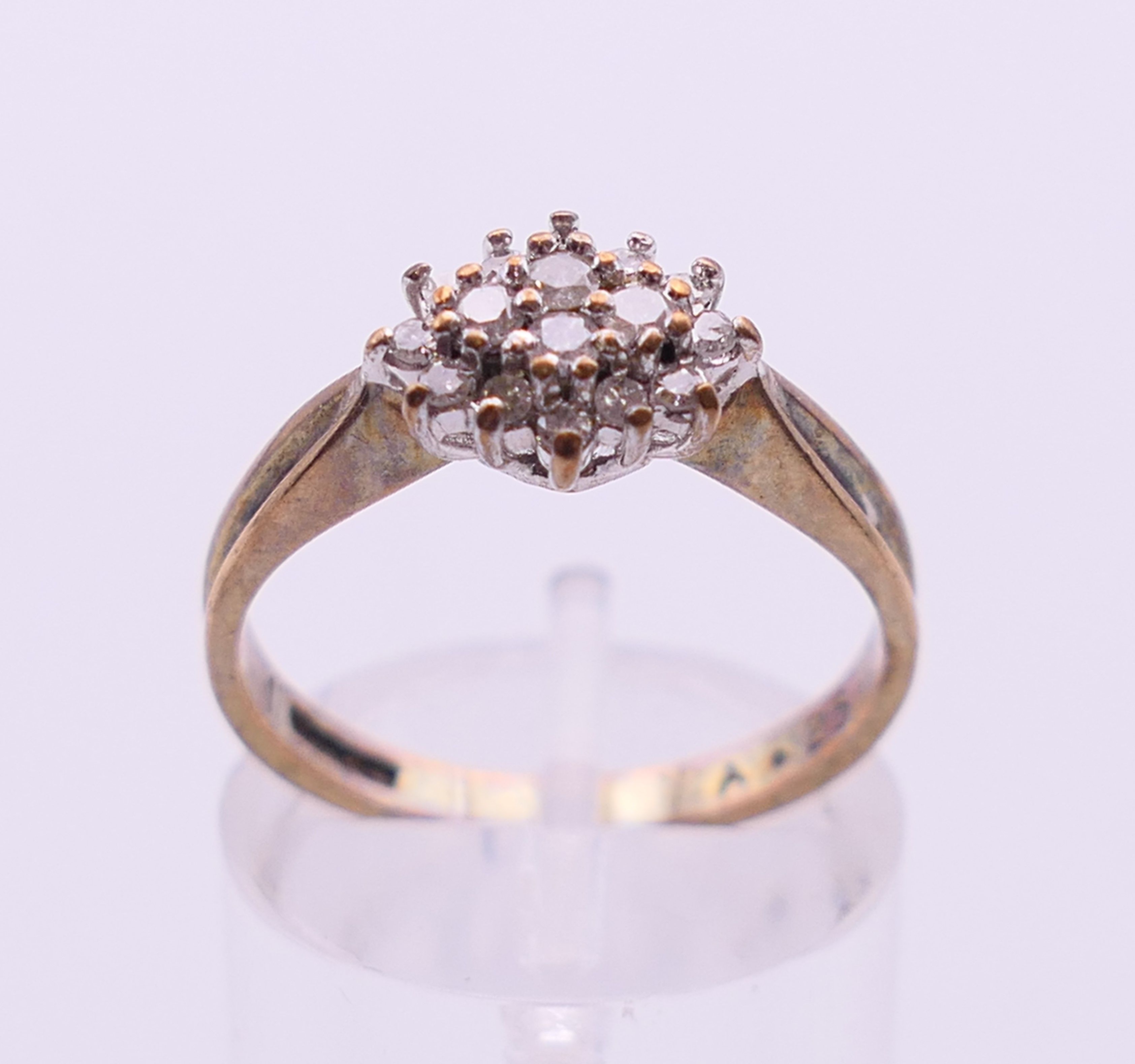 A 9 ct gold and diamond cluster ring. Ring size N/O. - Image 2 of 6