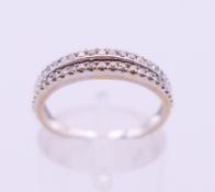 An 18 K white gold and diamond two-row ring. Ring size M.