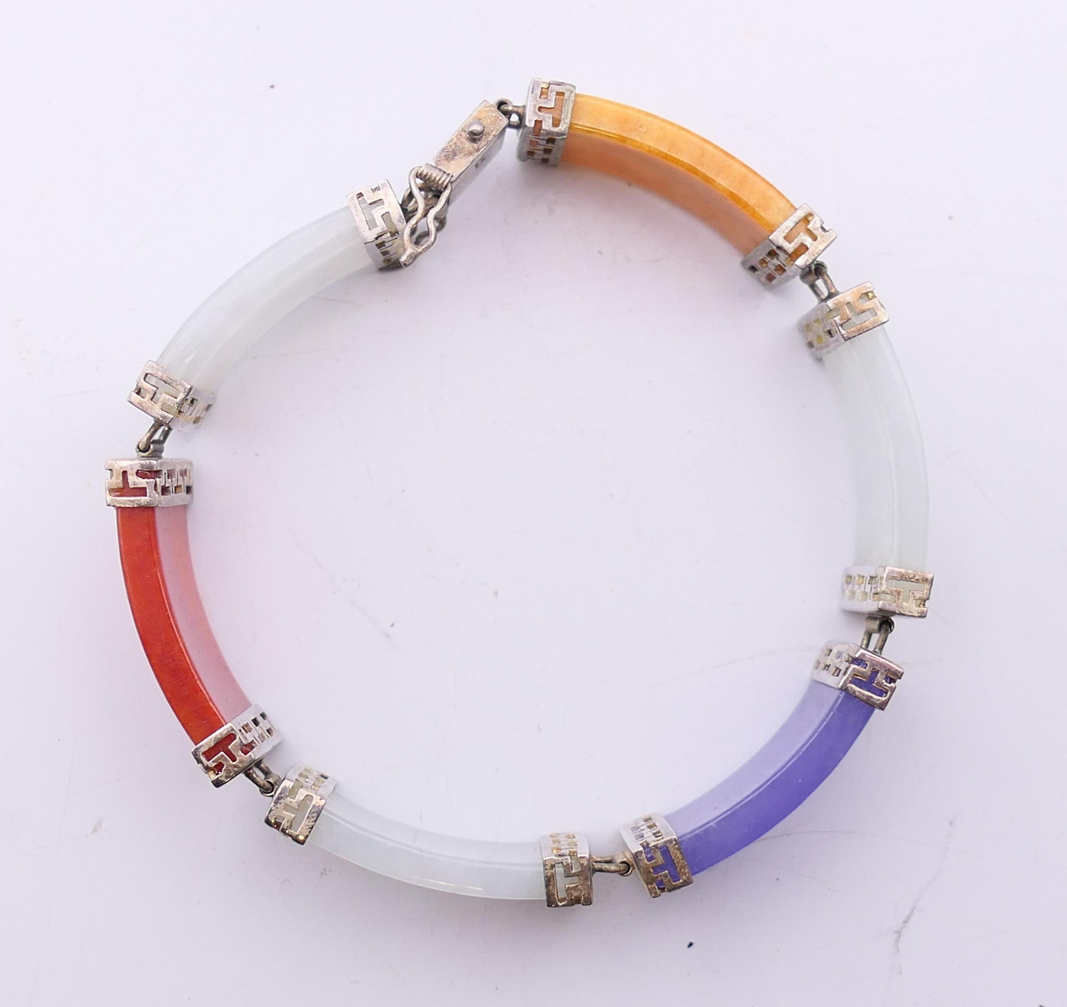 A Chinese multi-coloured jade bracelet set in silver. 18 cm long. - Image 4 of 6