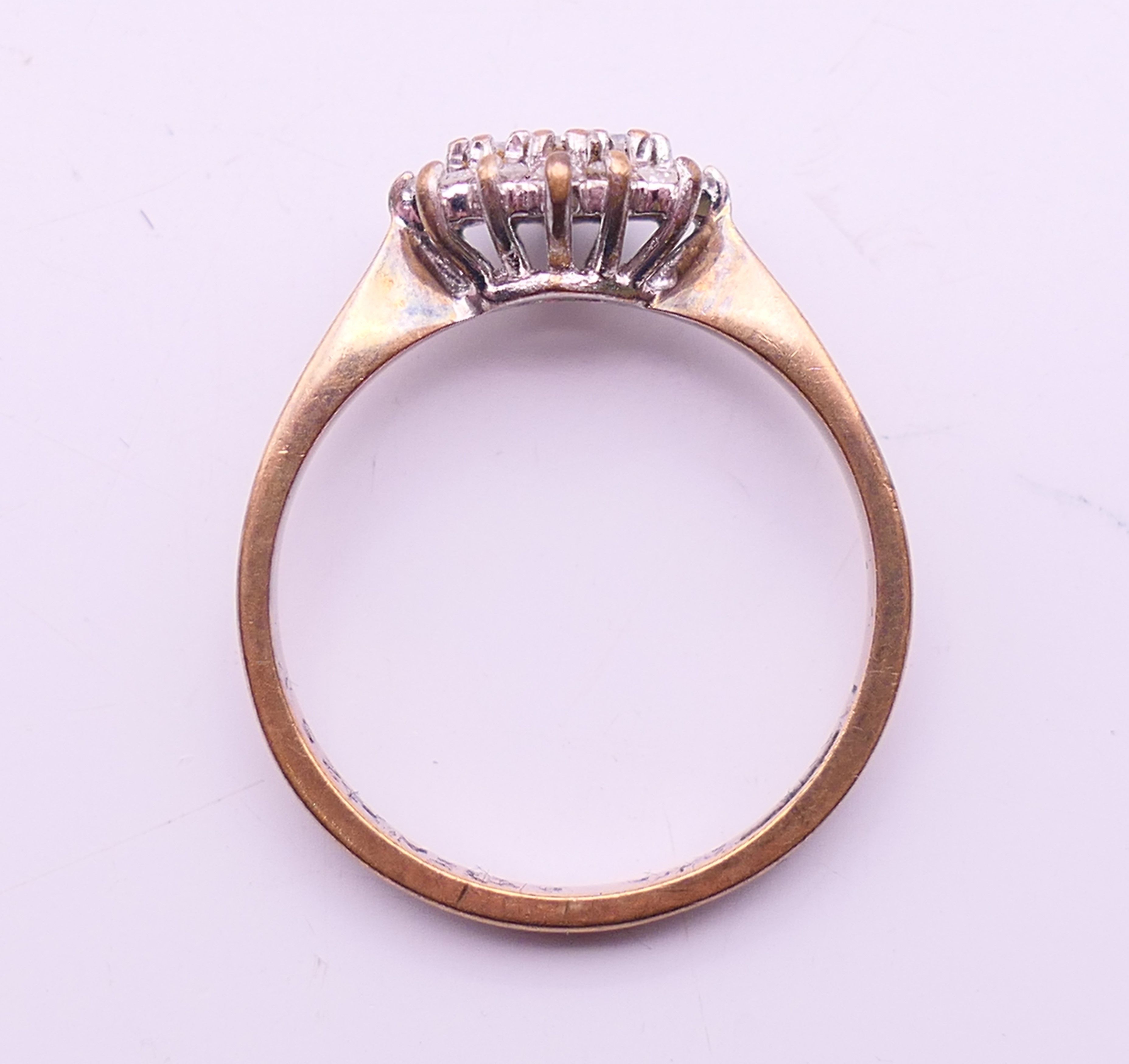 A 9 ct gold and diamond cluster ring. Ring size N/O. - Image 6 of 6