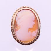 A 9 ct gold cameo ring. Ring size M. 6.1 grammes total weight.
