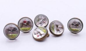 A set of six horse and jockey buttons. Each 1 cm diameter.