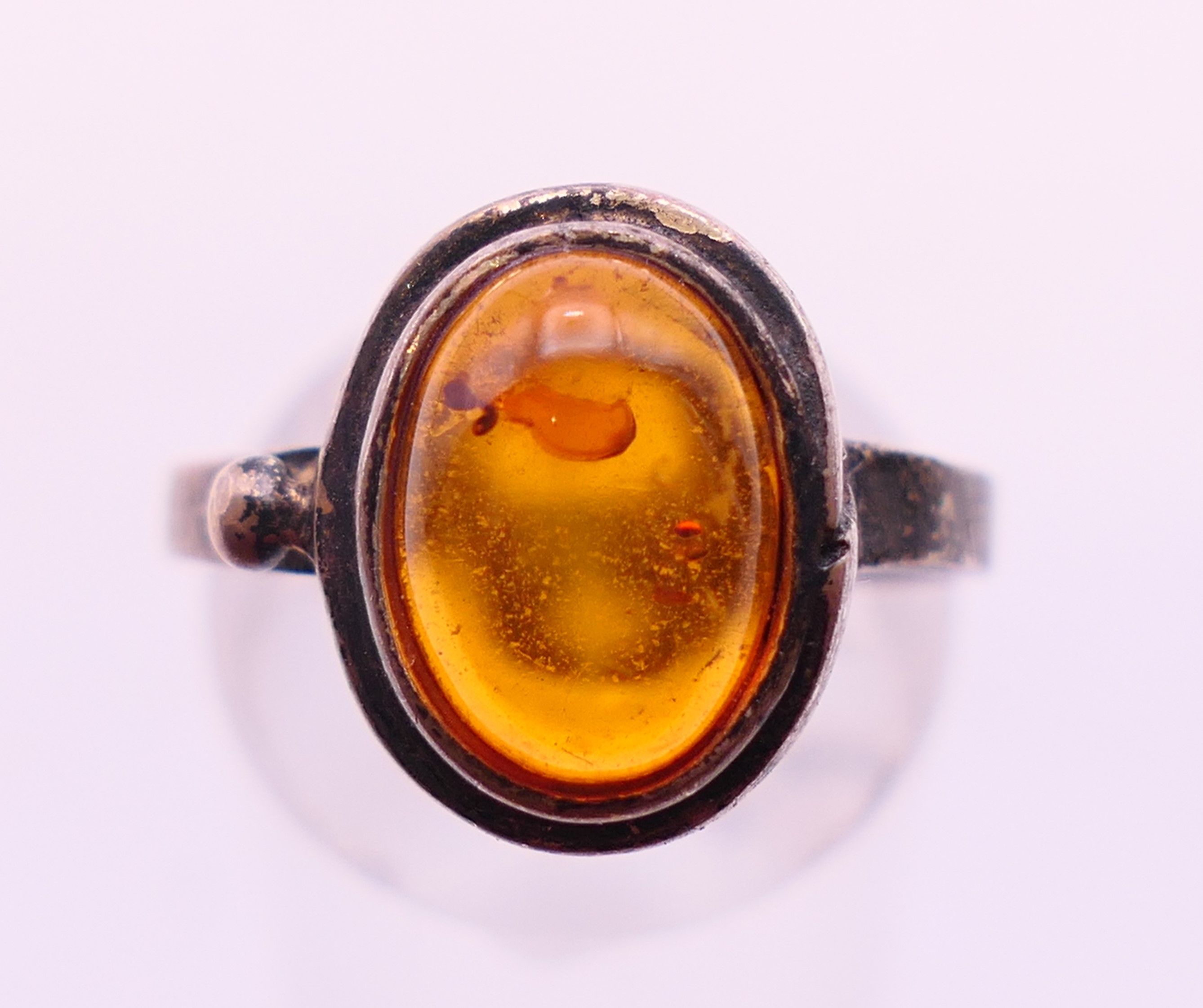 Four silver and amber items of jewellery. The largest pendant 5 cm high. - Image 5 of 11