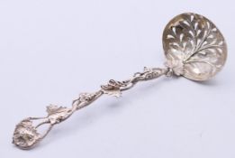 A highly-decorated Victorian silver sifter spoon, Birmingham 1854. 16 cm high.