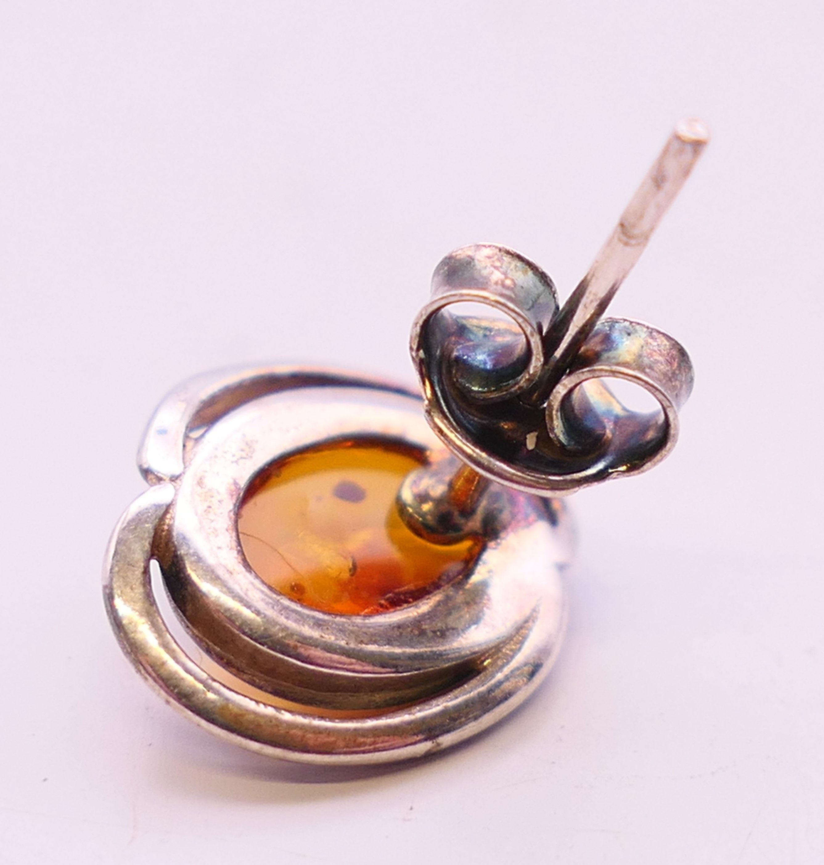 Four silver and amber items of jewellery. The largest pendant 5 cm high. - Image 11 of 11