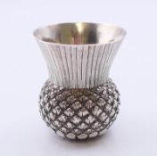A Victorian silver thistle form tot cup, hallmarked for Edinburgh 1883. 5 cm high.