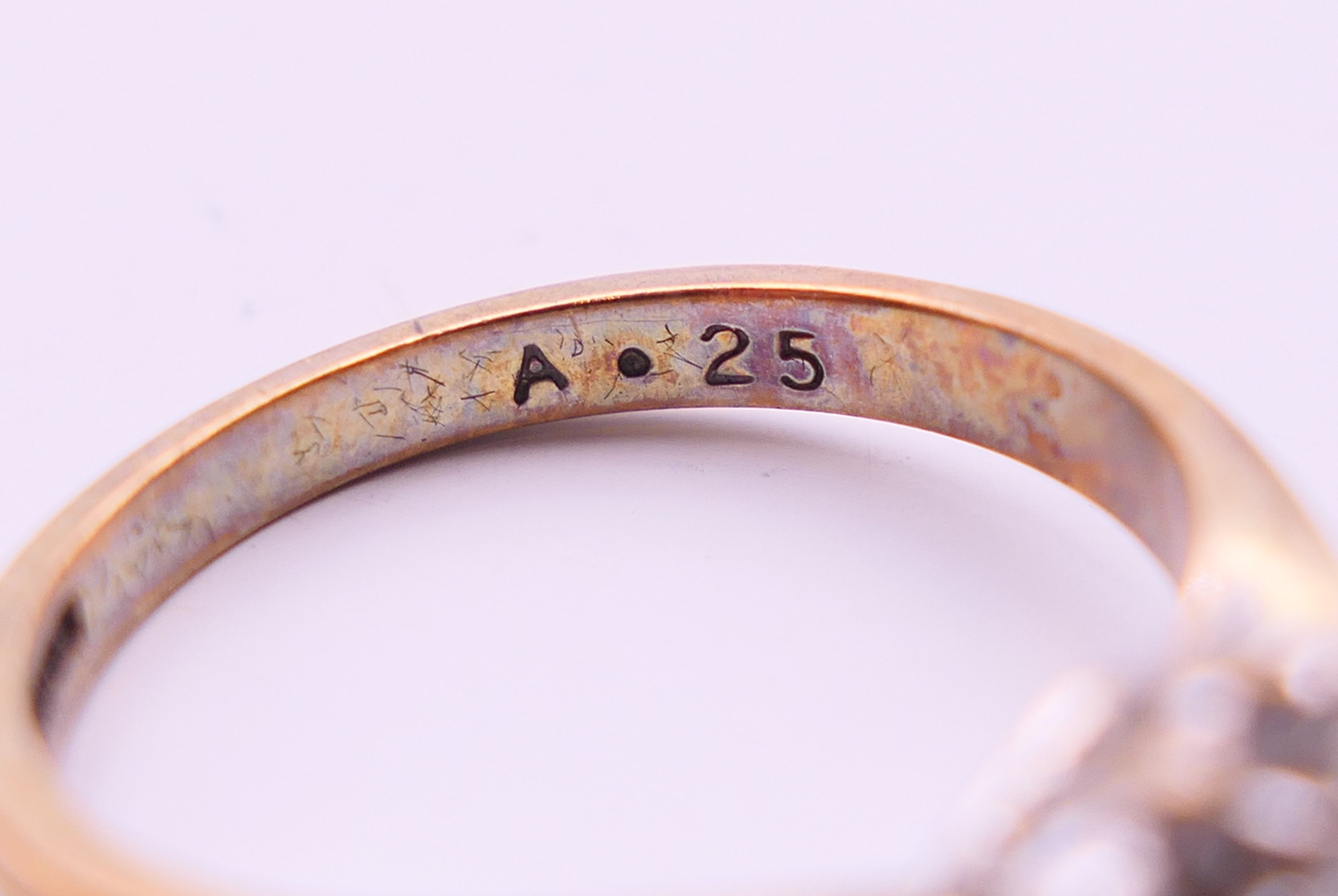 A 9 ct gold and diamond cluster ring. Ring size N/O. - Image 4 of 6