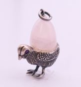 A silver rose quartz egg and chick pendant. 2.5 cm high.