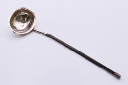 A baleen handled silver toddy ladle, hallmarked for London 1812. 19 cm long.