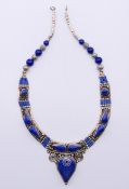 A lapis lazuli dress necklace. 38 cm long.