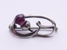 A Charles Horner Art Nouveau silver stylised single amethyst thistle brooch. 2.5 cm wide.