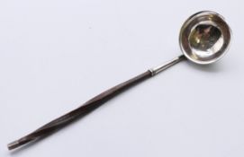 A baleen handled silver toddy ladle, hallmarked for London 1799. 18 cm long.