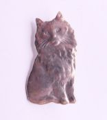 A silver cat brooch. 3 cm high.
