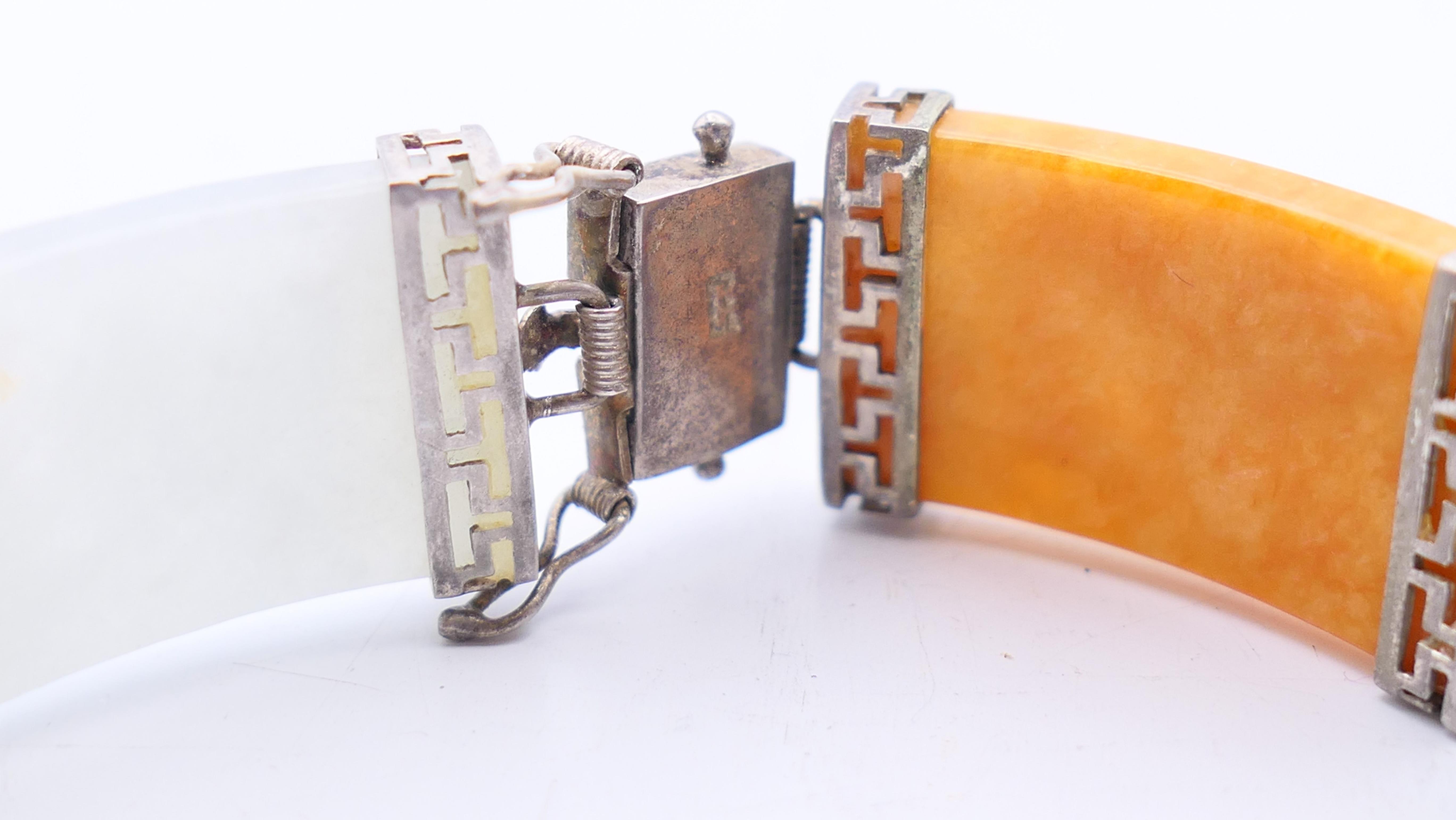 A Chinese multi-coloured jade bracelet set in silver. 18 cm long. - Image 3 of 6
