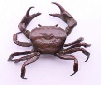 An articulated bronze model of a crab. 10 cm wide.