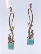 A pair of silver and turquoise earrings. 6 cm high.