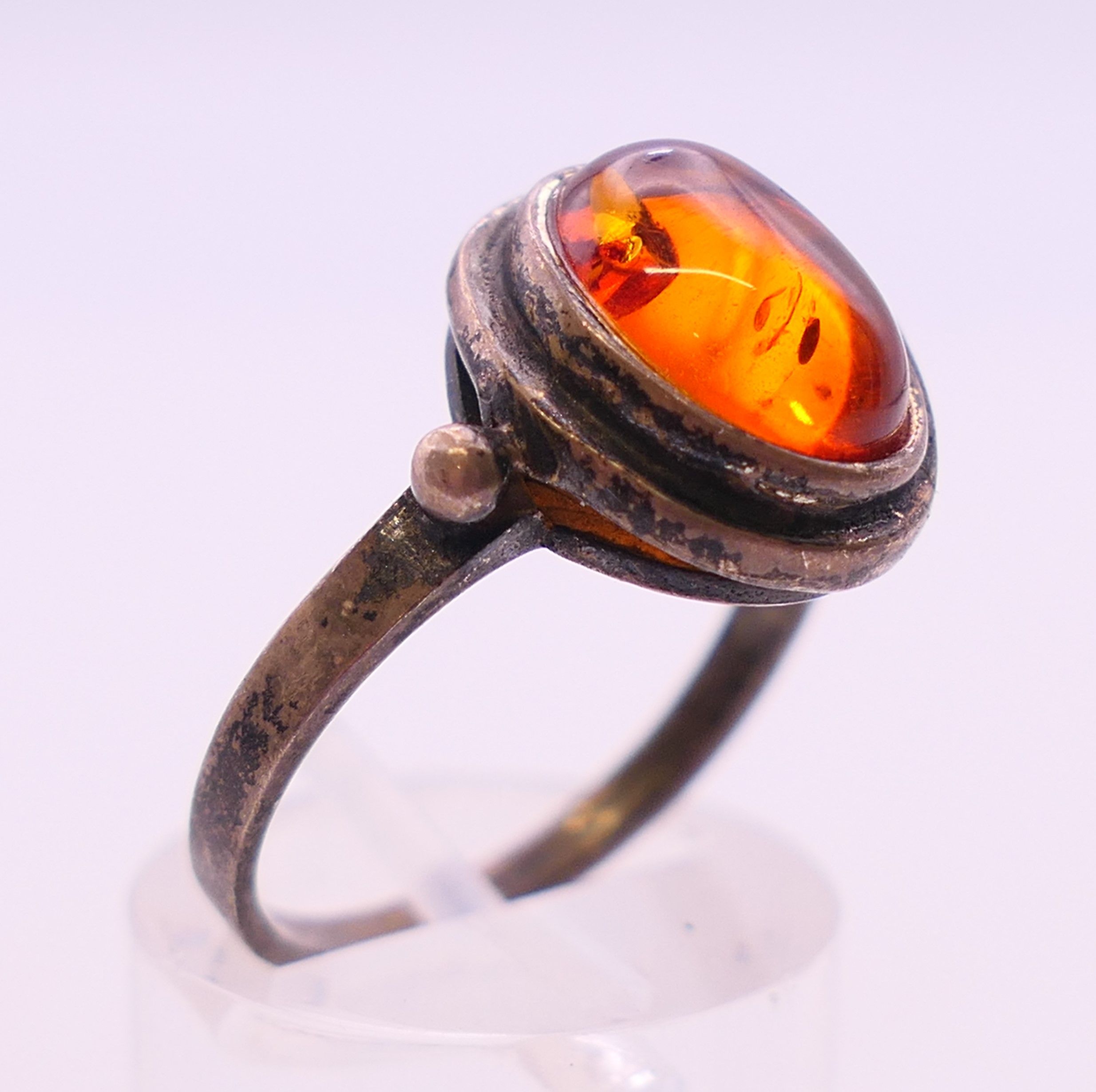 Four silver and amber items of jewellery. The largest pendant 5 cm high. - Image 6 of 11