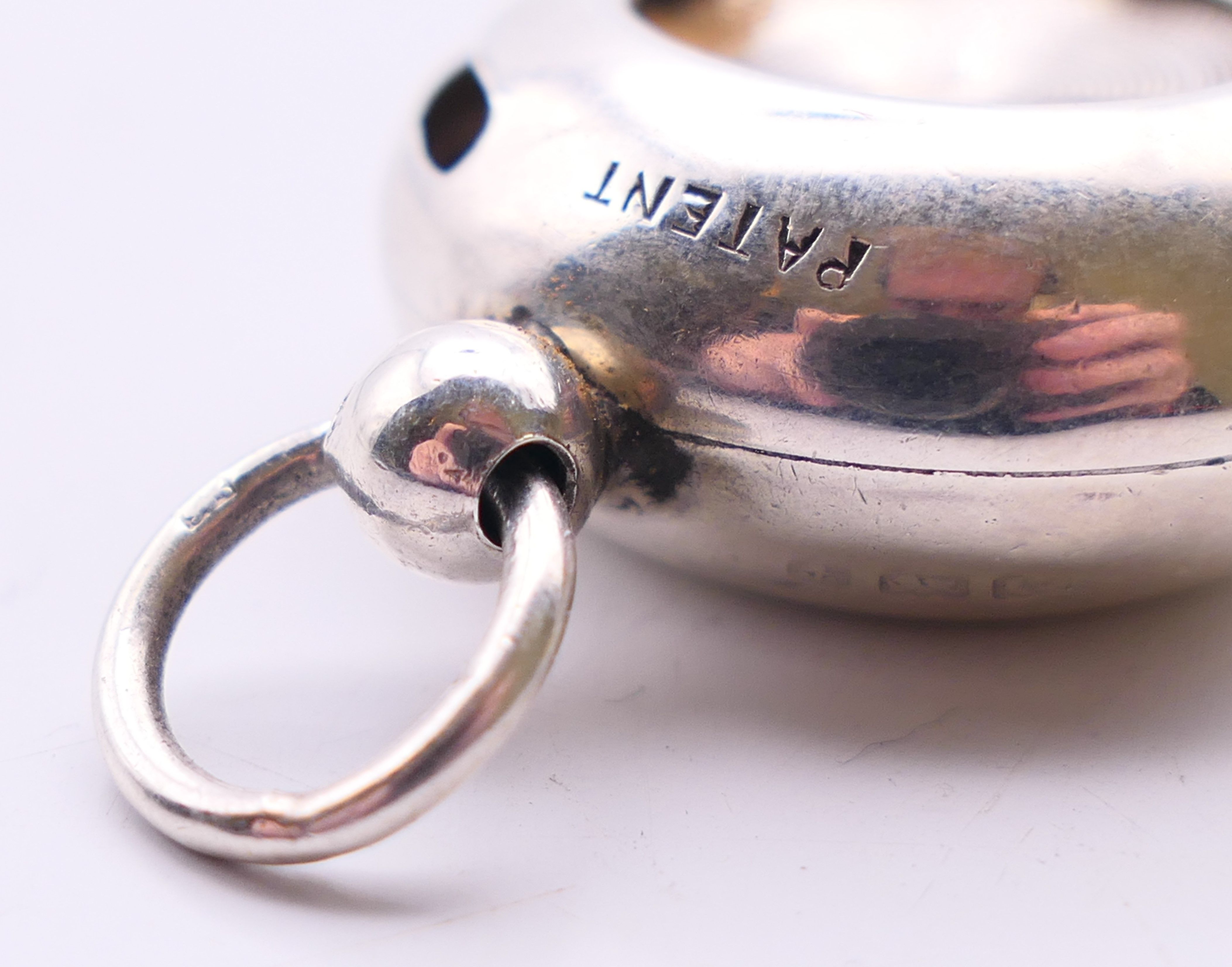 A silver sovereign holder. 3 cm diameter. - Image 2 of 4