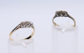 Two small 18 ct gold and platinum three-stone diamond rings. The largest ring size O, the other J.
