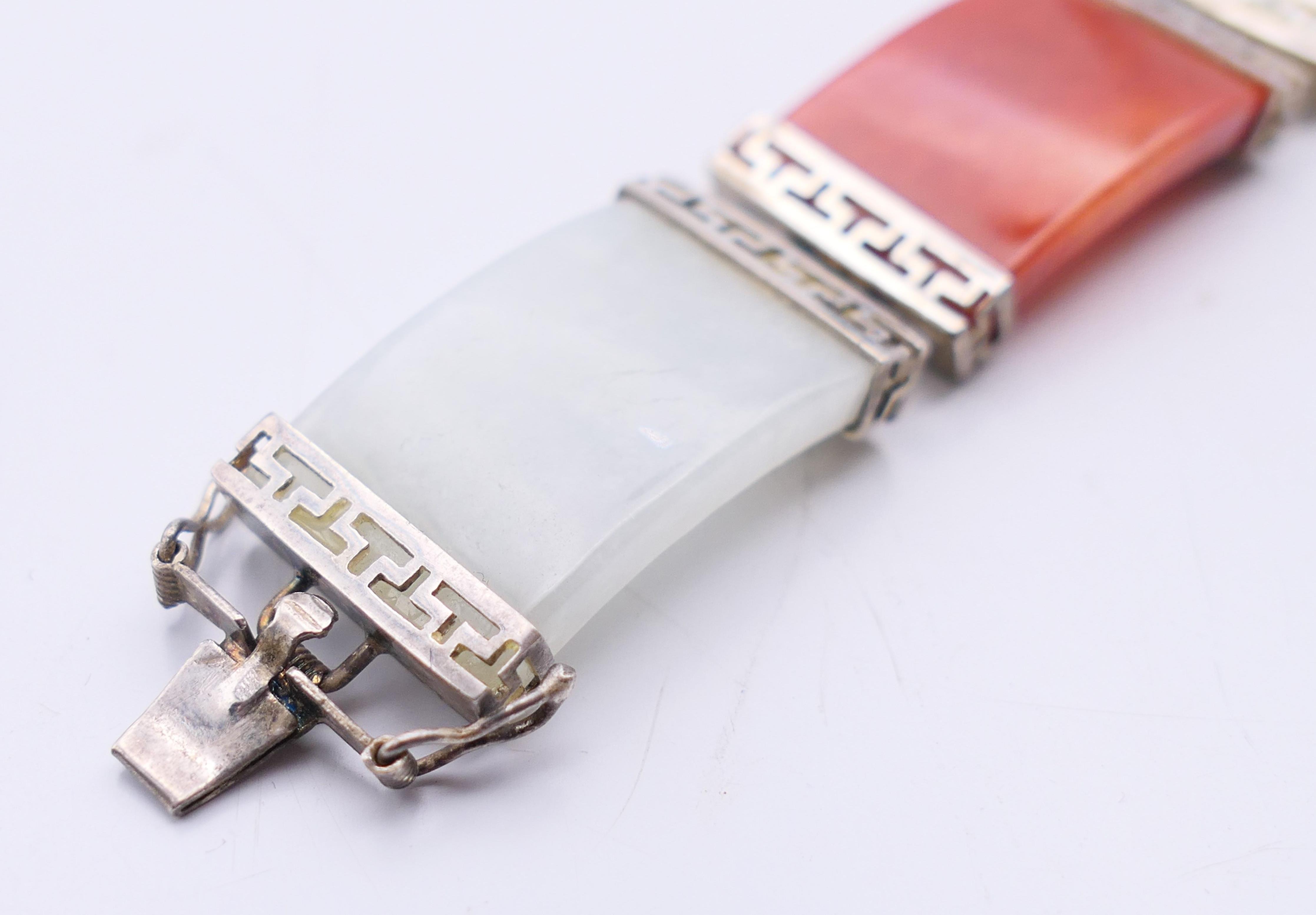 A Chinese multi-coloured jade bracelet set in silver. 18 cm long. - Image 6 of 6