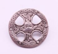 A Celtic silver brooch, hallmarked for Birmingham 1991, maker's mark W J & S. 2.75 cm diameter.