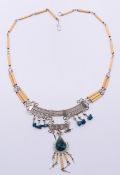 An ethnic white metal and green agate necklace. 46 cm long.