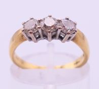 A diamond trilogy ring. Diamond weight approximately 0.60 ct. 3.3 grammes total weight.