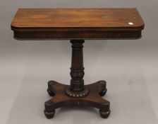 A Victorian rosewood folding card table. 91.5 cm wide.