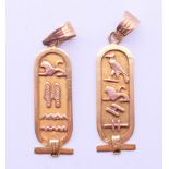 Two gold pendants decorated with Egyptian hieroglyphs. Each 3 cm high. 4 grammes.