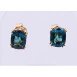 A pair of 14 ct gold London blue Topaz earrings. 7 x 5 mm.