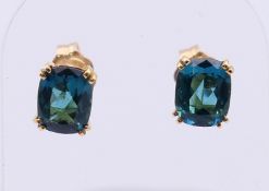 A pair of 14 ct gold London blue Topaz earrings. 7 x 5 mm.