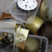 A box of clock and watch parts including movements, bells, bezels etc.