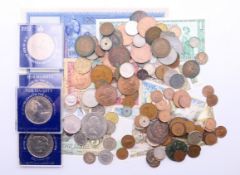 A quantity of coins, commemorative coins and bank notes.