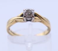 An 18 ct gold diamond solitaire ring. 2.7 grammes total weight. Ring size K/L.