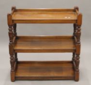 A Victorian walnut three-tier buffet. 89 cm wide.