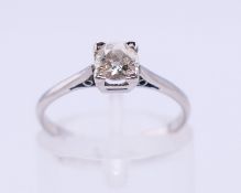 A platinum and diamond solitaire ring. Ring size K/L.