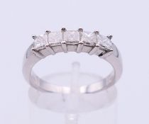 A 14 K white gold five-stone ring. Ring size O.